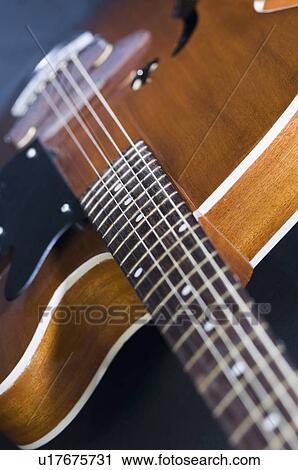 Close-up of an acoustic guitar View Large Photo Image Stock Image - Close-up of an acoustic guitar. Fotosearch