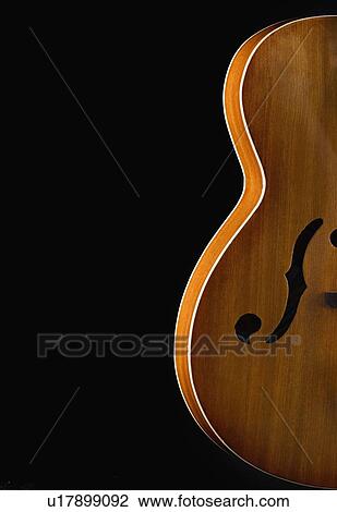Close-up of an acoustic guitar View Large Photo Image Stock Image - Close-up of an acoustic guitar. Fotosearch