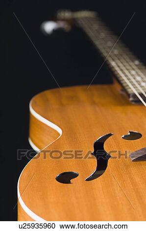 Close-up of an acoustic guitar View Large Photo Image Stock Image - Close-up of an acoustic guitar. Fotosearch