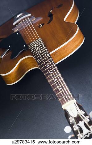 Close-up of an acoustic guitar View Large Photo Image Stock Photography - Close-up of an acoustic guitar. Fotosearch