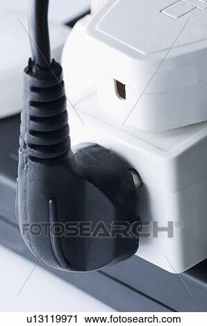 Close-up of electric plugs plugged into an extension socket View Large Photo Image Stock Image - Close-up of electric plugs plugged into an extension socket. Fotosearch