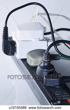Close-up of electric plugs plugged into an extension socket View Large Photo Image Stock Photograph - Close-up of electric plugs plugged into an extension socket. Fotosearch