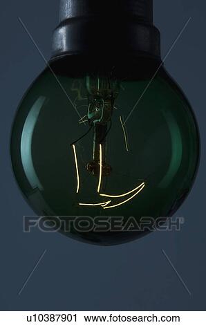 Stock Image - Close-up of the lit filament of a bulb. Fotosearch
