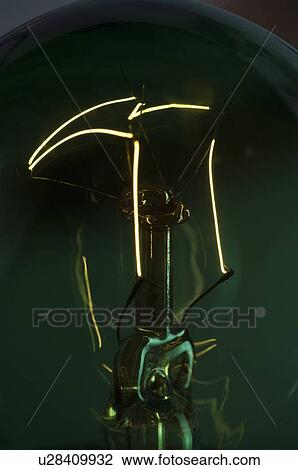 Close-up of the lit filament of a bulb View Large Photo Image Stock Image - Close-up of the lit filament of a bulb. Fotosearch