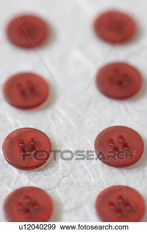 Stock Photo - High angle view of red buttons. Fotosearch