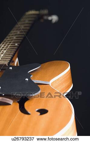 Close-up of an acoustic guitar View Large Photo Image Stock Photo - Close-up of an acoustic guitar. Fotosearch