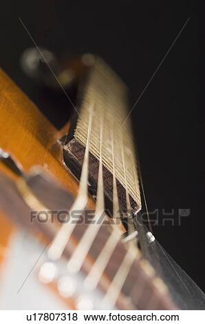 Stock Photo - Close-up of strings of a guitar. Fotosearch