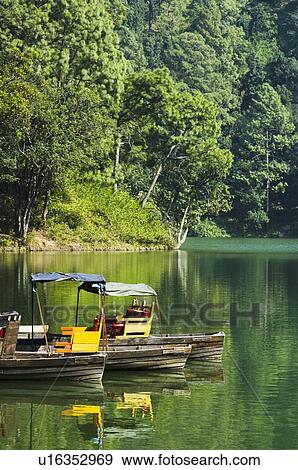 Boats in a lake View Large Photo Image Stock Photo - Boats in a lake. Fotosearch