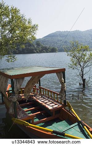 Stock Image - High angle view of a boat in a lake. Fotosearch