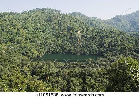 Stock Photo - High angle view of a lake surrounded by mountains. Fotosearch