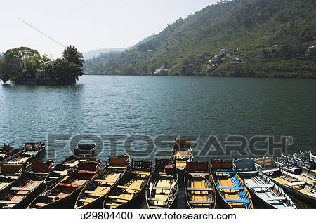 High angle view of boats docked at a lake View Large Photo Image Stock Image - High angle view of boats docked at a lake. Fotosearch