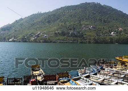 Stock Photograph - High angle view of boats docked at a lake. Fotosearch