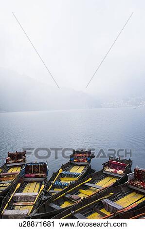 Stock Image - High angle view of boats moored in a lake. Fotosearch