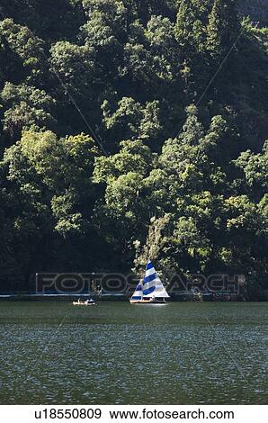 Sailboat in a lake View Large Photo Image Stock Photo - Sailboat in a lake. Fotosearch