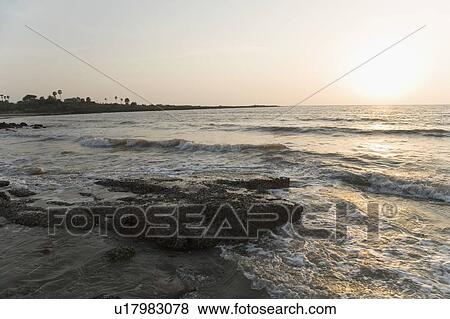 Stock Photo - Sunset over the sea. Fotosearch