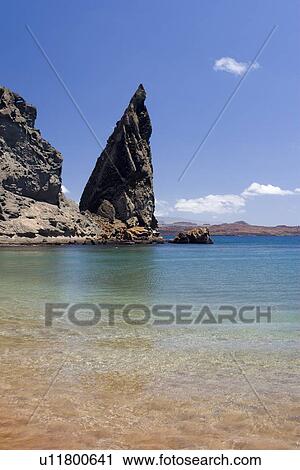 Stock Image - Famous pinnacle at Bartholome Island in the Galapagos Island Archipeligo, Ecuador.. Fotosearch