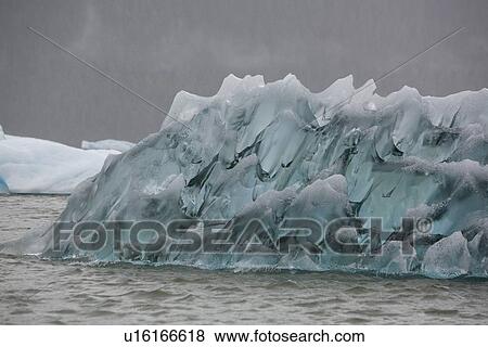 Stock Photo - Interesting pattern on an iceberg calved from the LeConte Glacier just outside Petersburg, Southeast Alaska, USA. Pacific Ocean.. Fotosearch