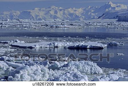Stock Photo - Open pack ice and Admiralty Mountains Range in background. Adare Peninsula, Ross Sea, Antarctica. Fotosearch