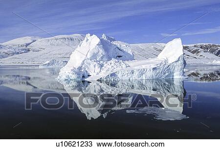 Stock Image - Drifting iceberg in Hare fjord. Scoresbysund, East Greenland. Fotosearch