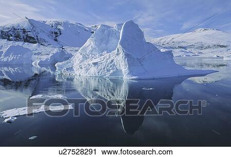 Stock Image - Drifting iceberg in Hare fjord. Scoresbysund, East Greenland. Fotosearch