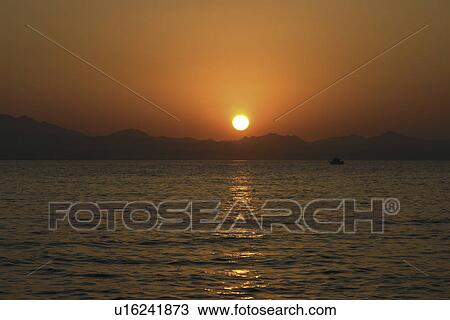 Stock Image - Sunset over the mountains of marsa Alam, Red Sea. Egypt. . Fotosearch