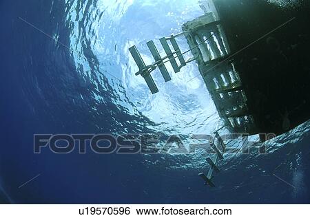 Underwater view of a boat. Compasspoint, Caymans. View Large Photo Image Stock Photograph - Underwater view of a boat. Compasspoint, Caymans.. Fotosearch