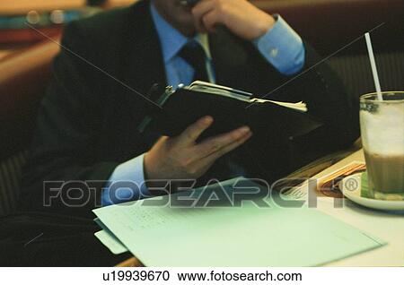 Man Looking At Organizer View Large Photo Image Stock Image - Man Looking At Organizer. Fotosearch