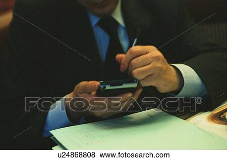 Man Using Handheld Computer View Large Photo Image Stock Photo - Man Using Handheld Computer. Fotosearch