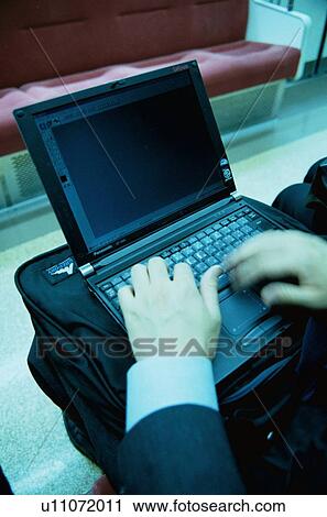 Stock Image - Man With Laptop On Train. Fotosearch