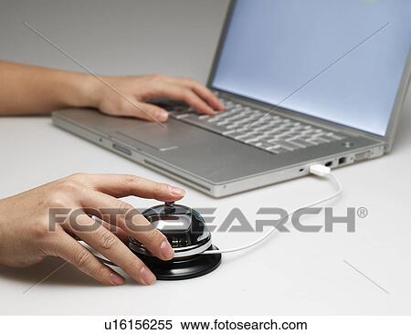 Person Using Laptop with Desk Bell View Large Photo Image Stock Photography - Person Using Laptop with Desk Bell. Fotosearch