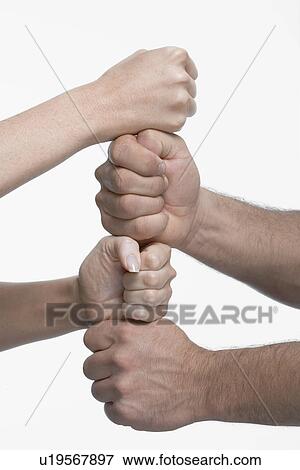 Woman and man stacking fists, close-up View Large Photo Image Stock Photo - Woman and man stacking fists, close-up. Fotosearch