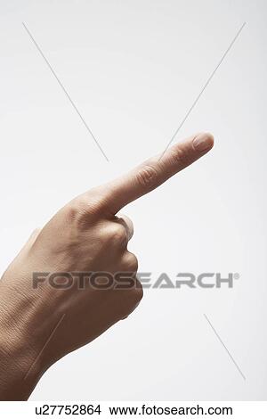 Picture - Woman's hand pointing (close-up). Fotosearch