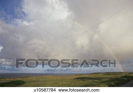 Picture - Clouds And A Rainbow. Fotosearch