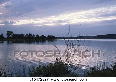 Stock Photo - The Lakeside In A Morning Glow. Fotosearch