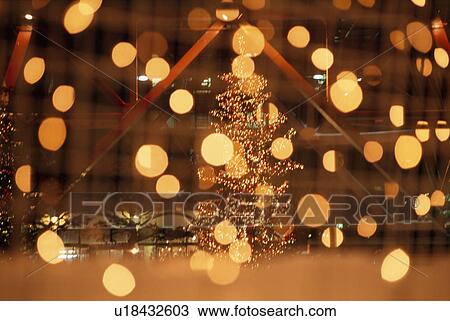 Stock Image - Light Spots And Christmas Tree. Fotosearch