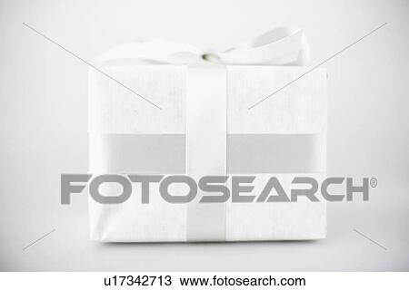 Stock Image - Gift in white packaging. Fotosearch