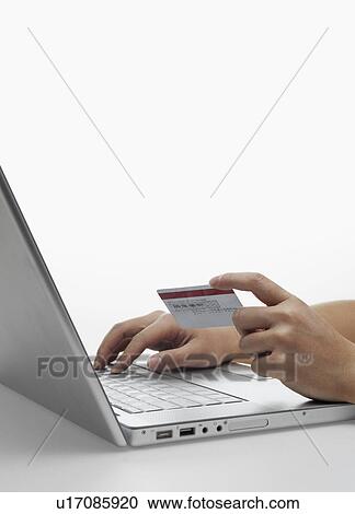Stock Image - Person Online Shopping. Fotosearch
