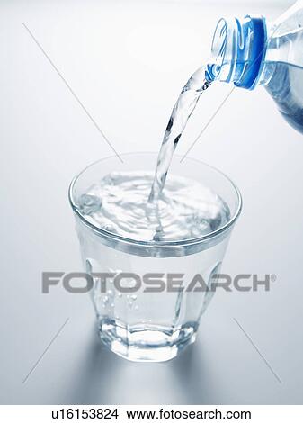 Water Being Pouring in Glass View Large Photo Image Picture - Water Being Pouring in Glass. Fotosearch