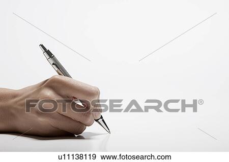 Woman's hand holding pen (close-up) View Large Photo Image Stock Photo - Woman's hand holding pen (close-up). Fotosearch