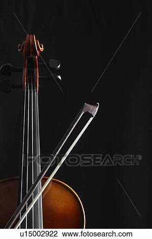Stock Image - Single violin and bow (close-up). Fotosearch