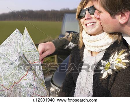 Stock Image - Couple looking at map . Fotosearch