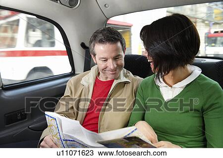 Couple reading map in London Taxi View Large Photo Image Stock Image - Couple reading map in London Taxi. Fotosearch
