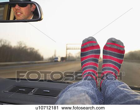 Feet on dashboard View Large Photo Image Stock Image - Feet on dashboard. Fotosearch