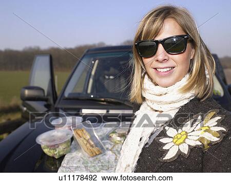Young woman at rest stop View Large Photo Image Stock Image - Young woman at rest stop. Fotosearch