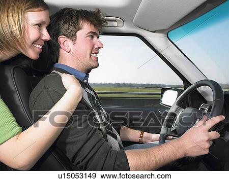 Young woman hugging driver View Large Photo Image Stock Photo - Young woman hugging driver. Fotosearch