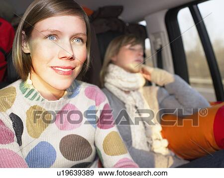 Young women in car View Large Photo Image Stock Photo - Young women in car. Fotosearch