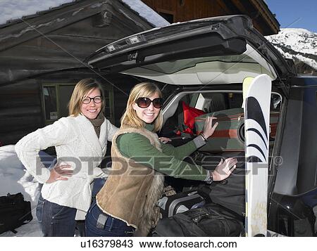 Young women packing car View Large Photo Image Stock Image - Young women packing car. Fotosearch