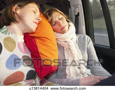 Young women sleeping in car View Large Photo Image Picture - Young women sleeping in car. Fotosearch