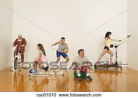 Download People exercising on exercise machines Stock Image ...