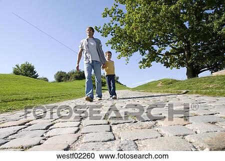 Download Father walking with son hand in hand Stock Image ...